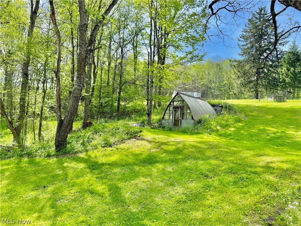 11811 Gaston Road Rogers, OH 44455 - Photo 5 of 38 You've got several acres of usable space, pole barns, and a Quonset Hut (currently used for recreation). Take advantage of the room to play, and play!!
