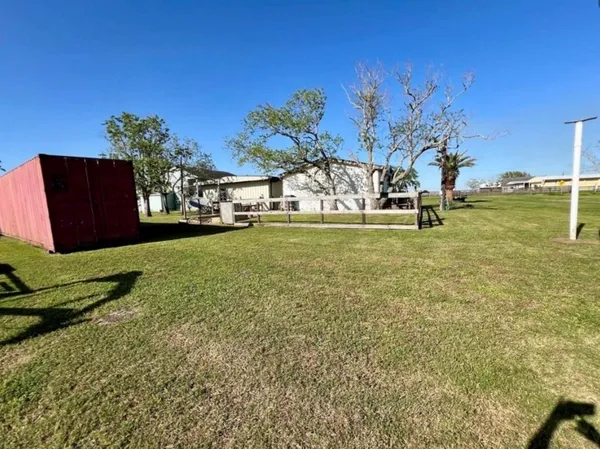 a view of a yard with an outdoor space