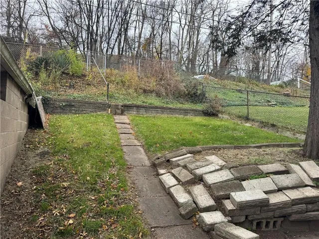 a backyard of a house with lots of green space