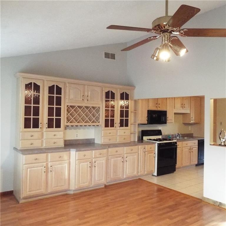 508 Aten Road Coraopolis, PA 15108 - Photo 3 of 25 KITCHEN OPENS TO DINING ROOM WITH VAULTED CEILINGS AND LAMINATE FLOORING.