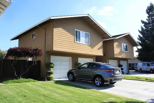 a view of a yard in front of a house