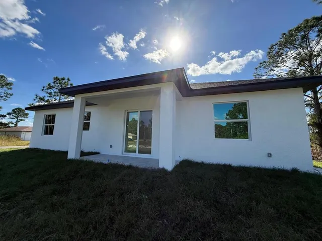 a view of a house with a yard