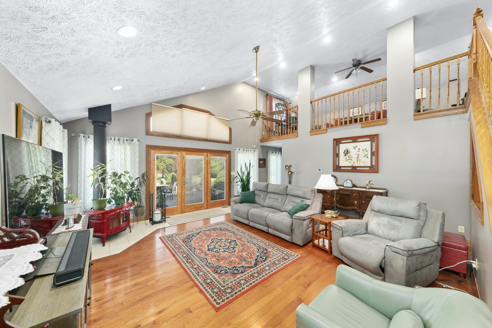 26310 South McKinley Woods Road Channahon, IL 60410 - Photo 13 of 49 a living room with furniture fireplace and a large window