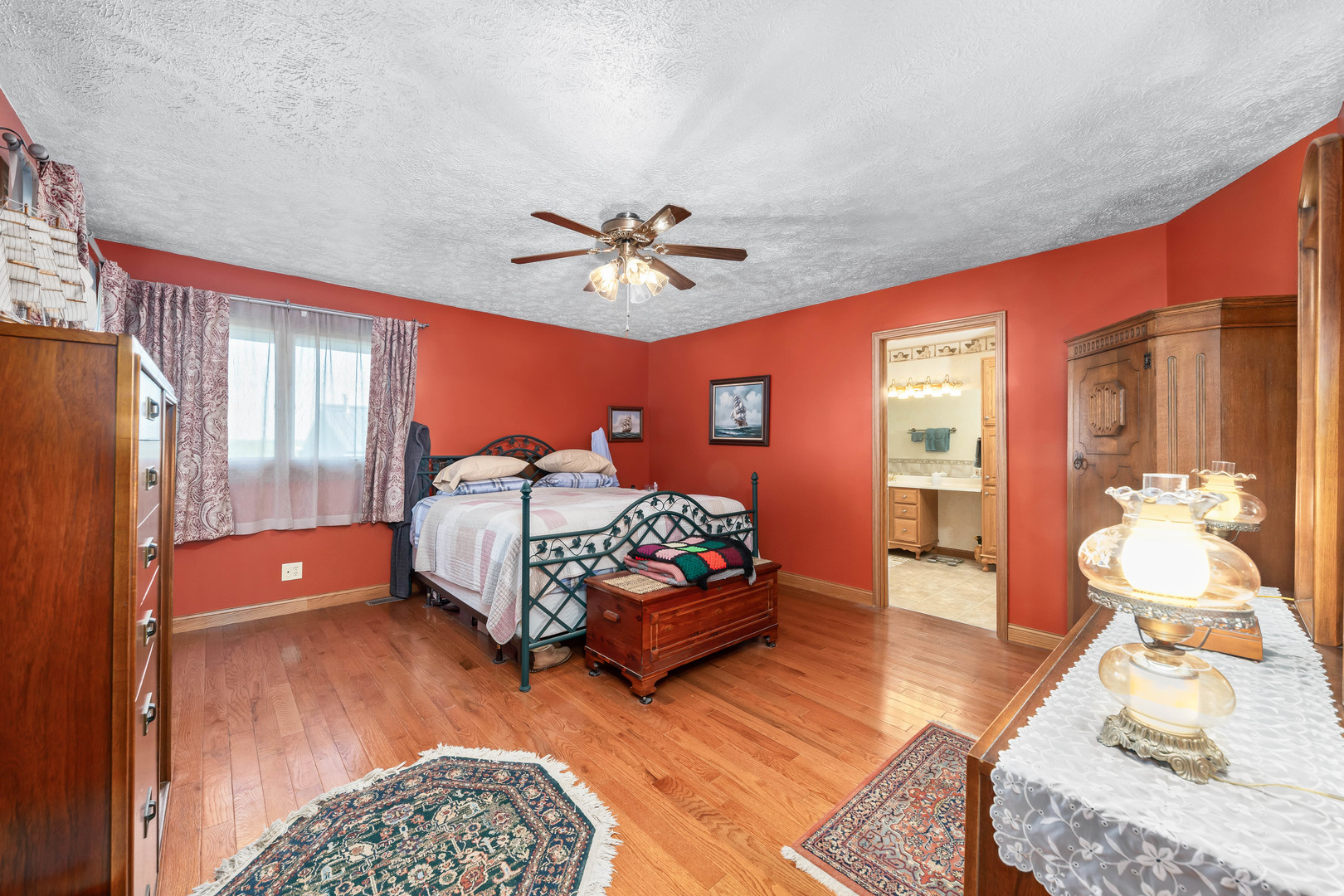 26310 South McKinley Woods Road Channahon, IL 60410 - Photo 19 of 49 a bedroom with a bed and wooden floor