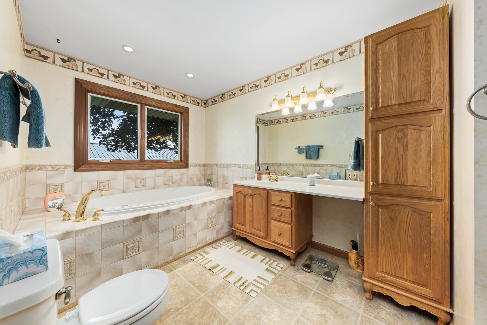 26310 South McKinley Woods Road Channahon, IL 60410 - Photo 22 of 49 a spacious bathroom with a tub sink and mirror
