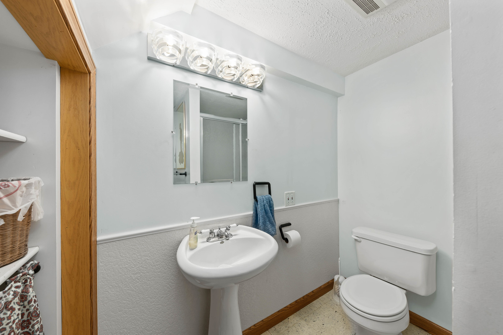 26310 South McKinley Woods Road Channahon, IL 60410 - Photo 34 of 49 a bathroom with a toilet sink and mirror