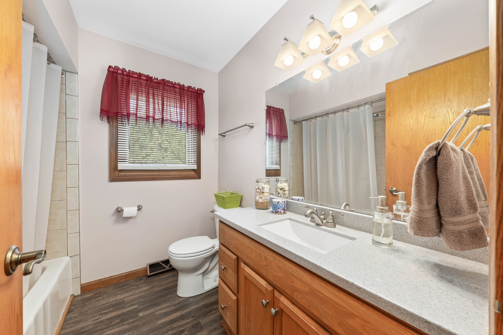 26310 South McKinley Woods Road Channahon, IL 60410 - Photo 35 of 49 a bathroom with a sink a vanity and a large mirror