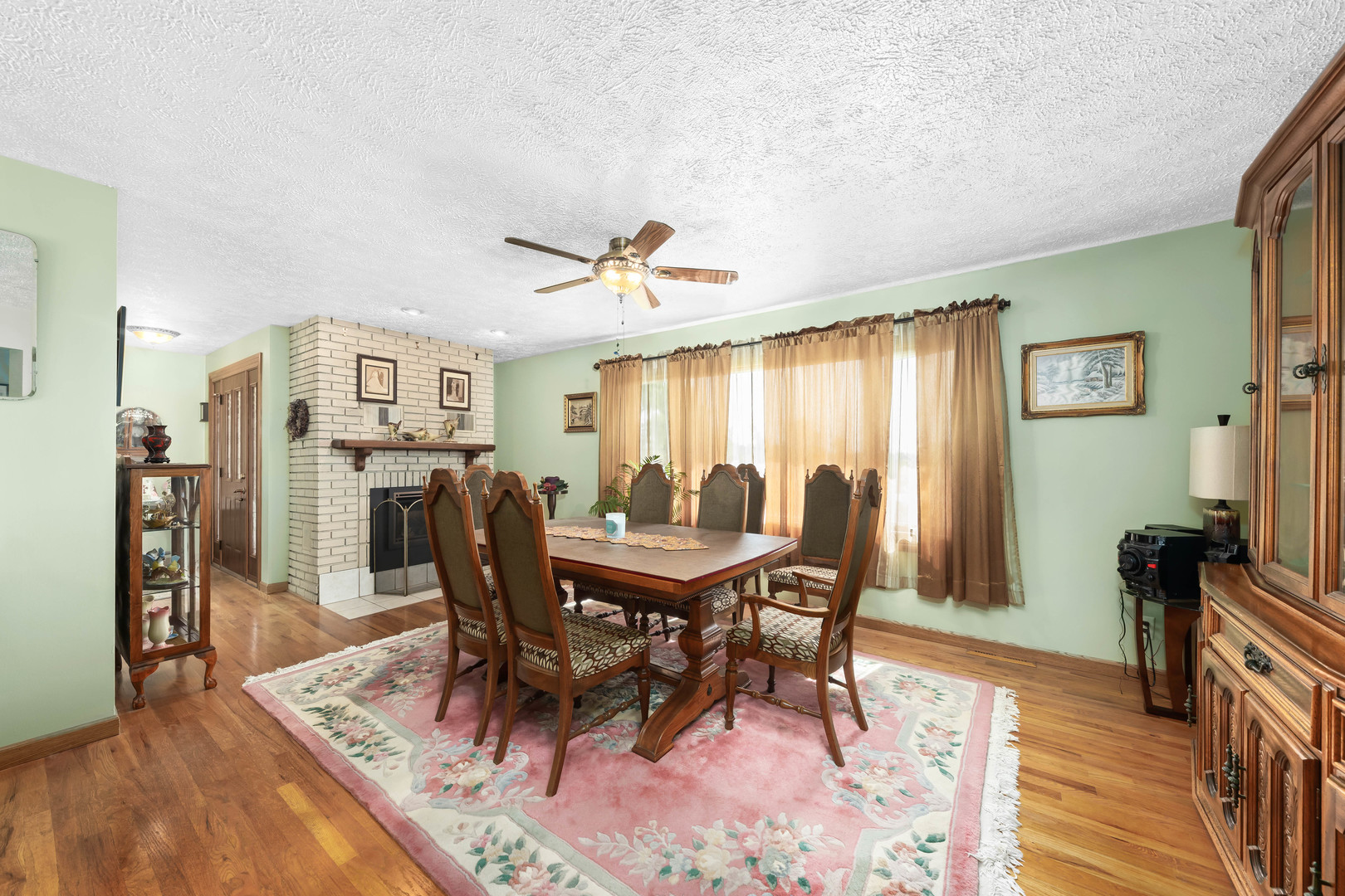 26310 South McKinley Woods Road Channahon, IL 60410 - Photo 4 of 49 a view of a dining room with furniture and wooden floor