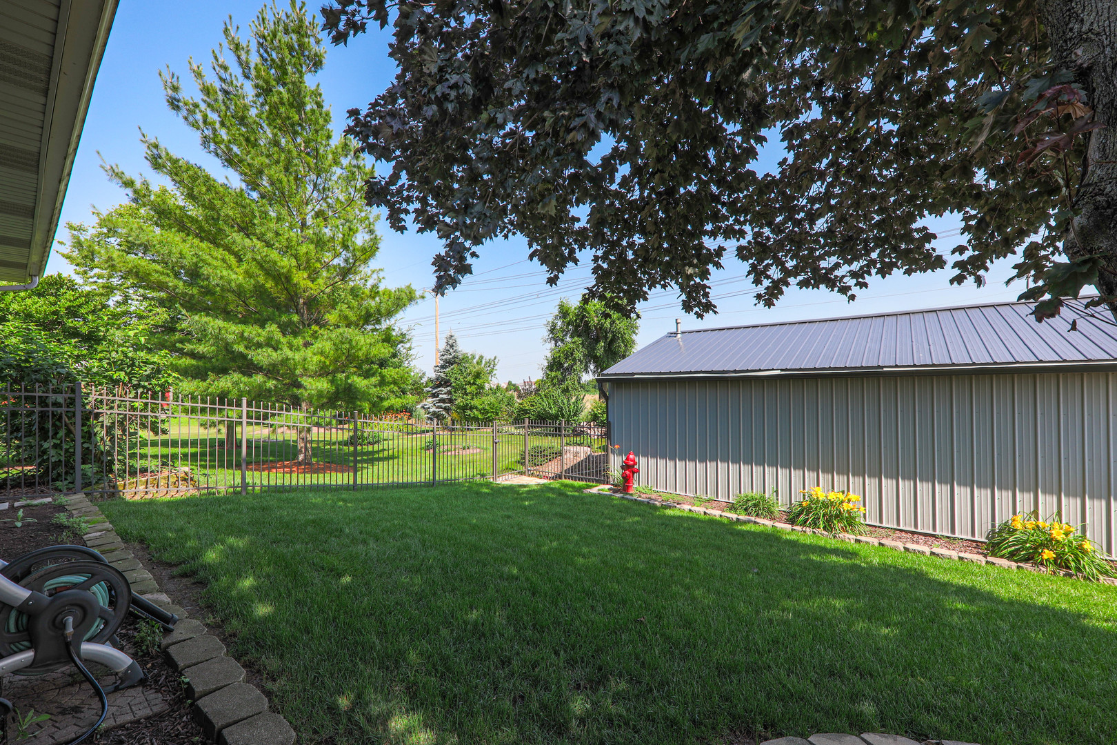26310 South McKinley Woods Road Channahon, IL 60410 - Photo 45 of 49 a view of a backyard with a garden