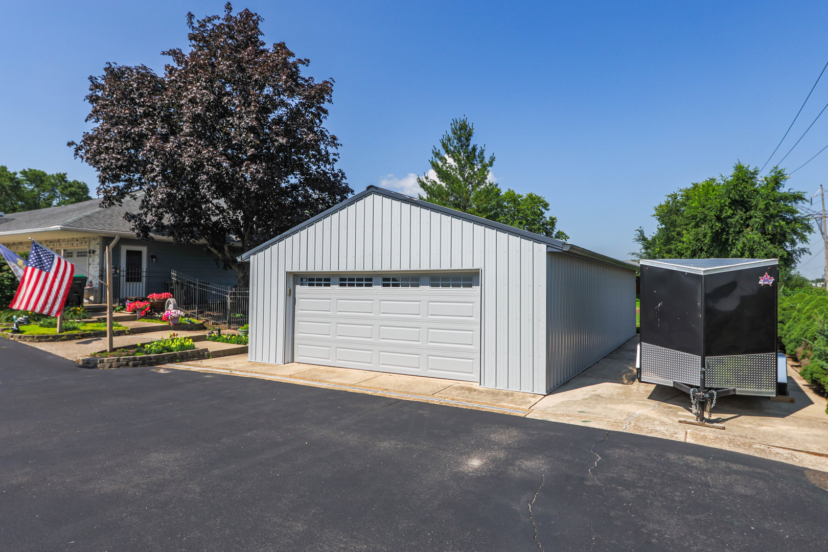 26310 South McKinley Woods Road Channahon, IL 60410 - Photo 48 of 49 a view of a house with a yard and garage