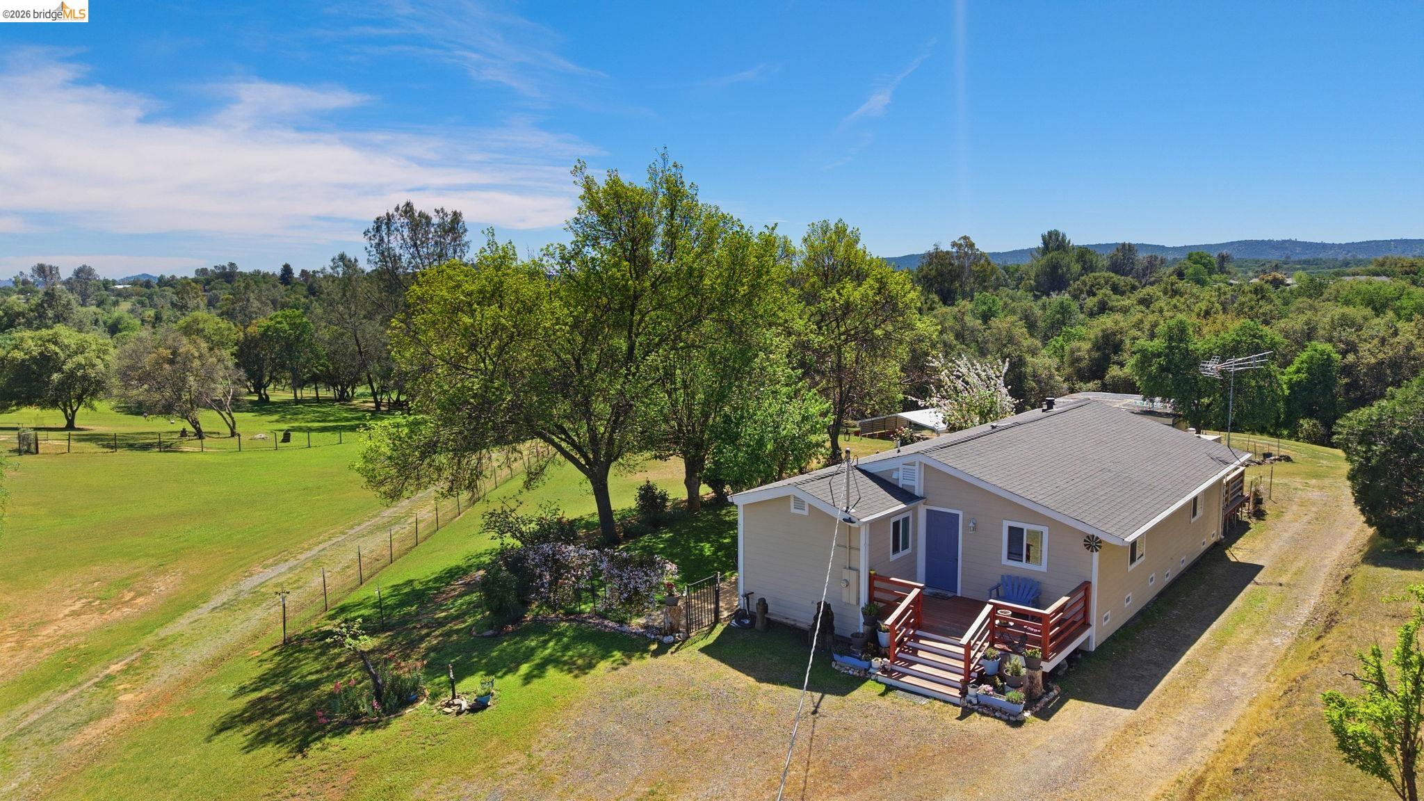 a aerial view of a house with a yard