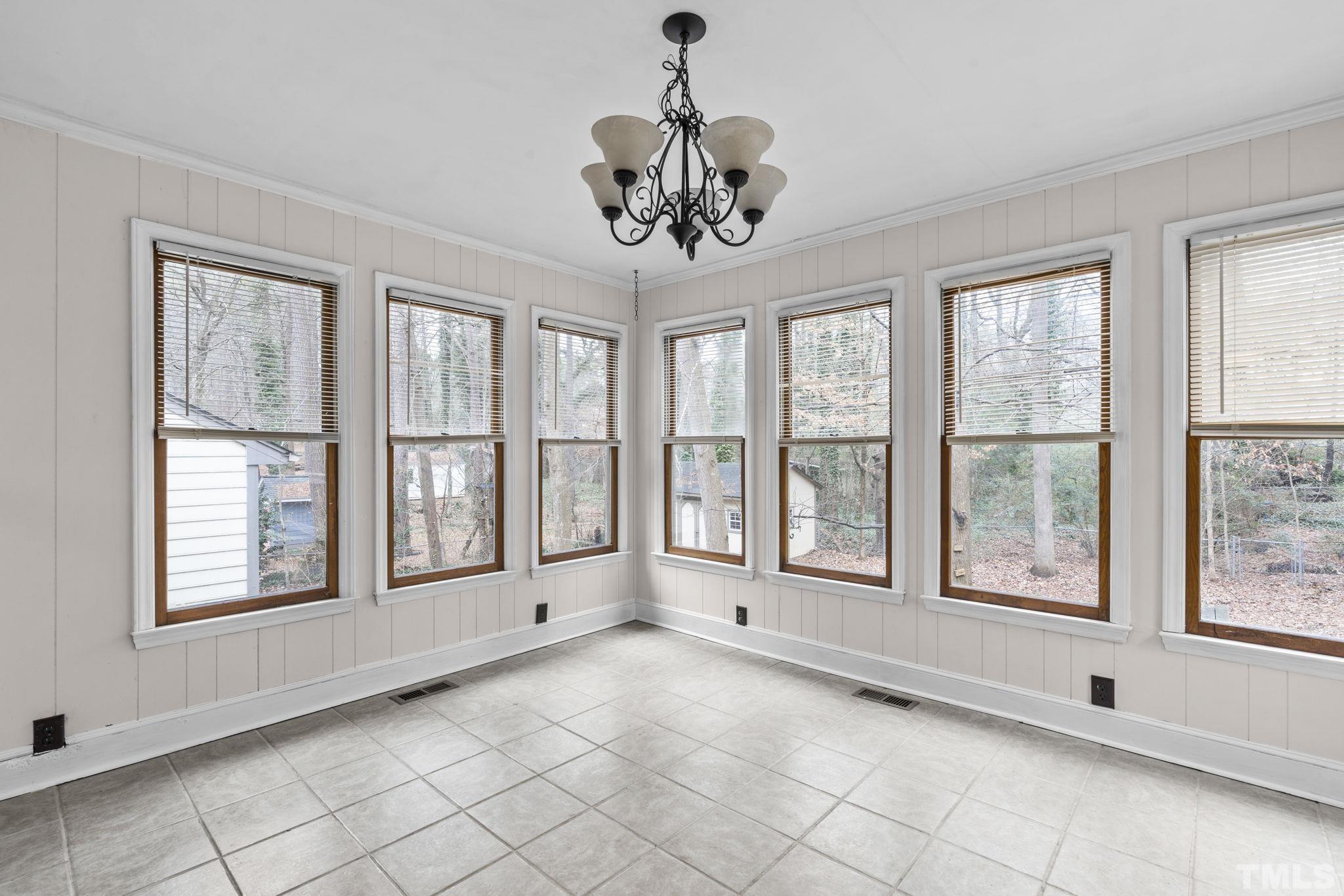805 Van Thomas Drive Raleigh, NC 27615 - Photo 12 of 38 a view of an empty room with a window