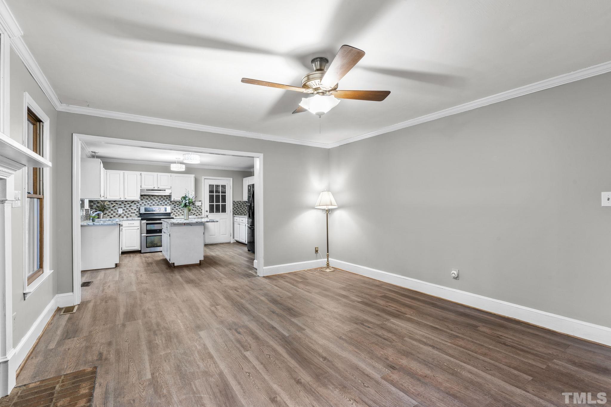 805 Van Thomas Drive Raleigh, NC 27615 - Photo 14 of 38 a view of a kitchen with wooden floor and a kitchen