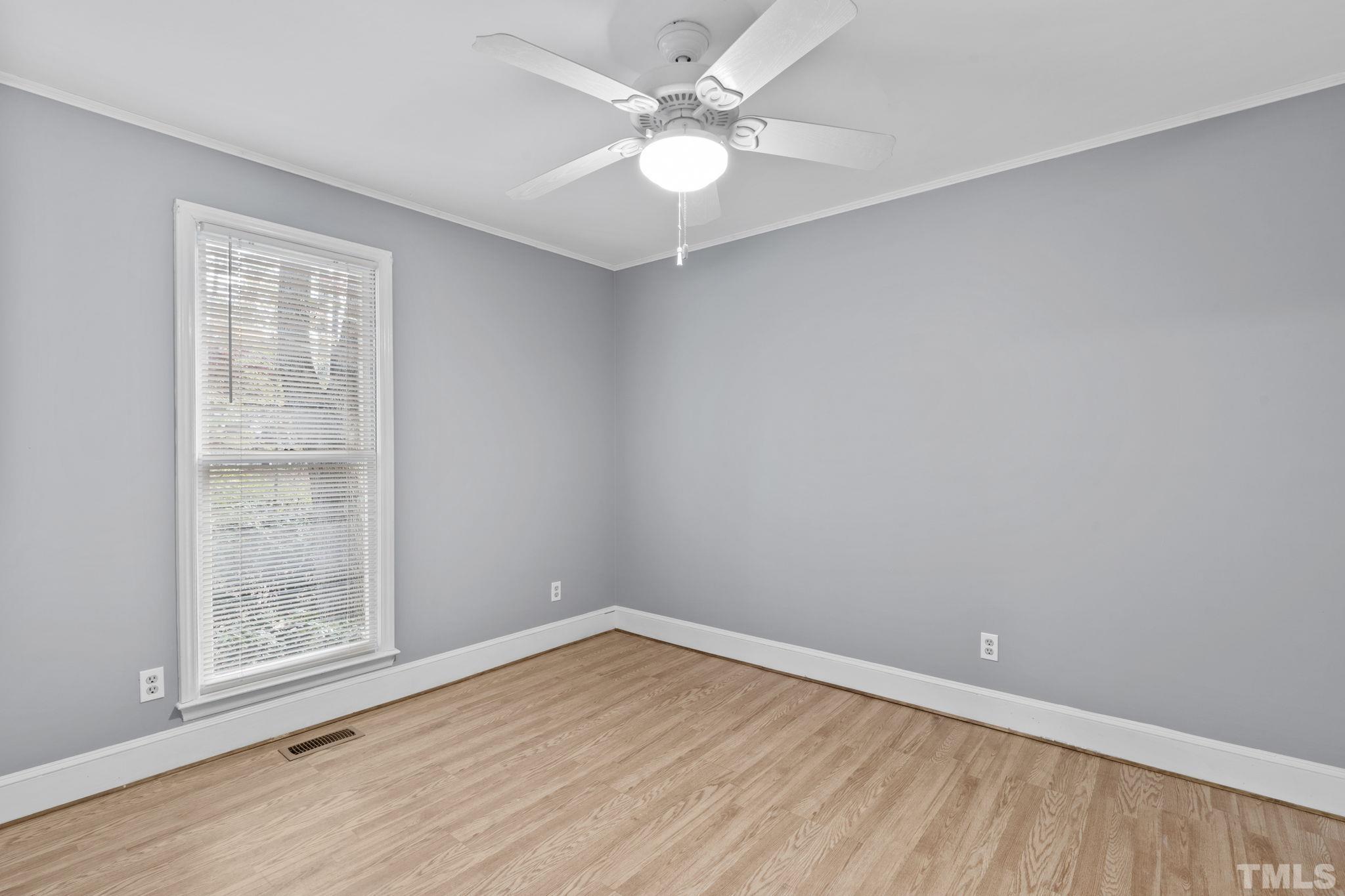 805 Van Thomas Drive Raleigh, NC 27615 - Photo 19 of 38 wooden floor in an empty room with a window