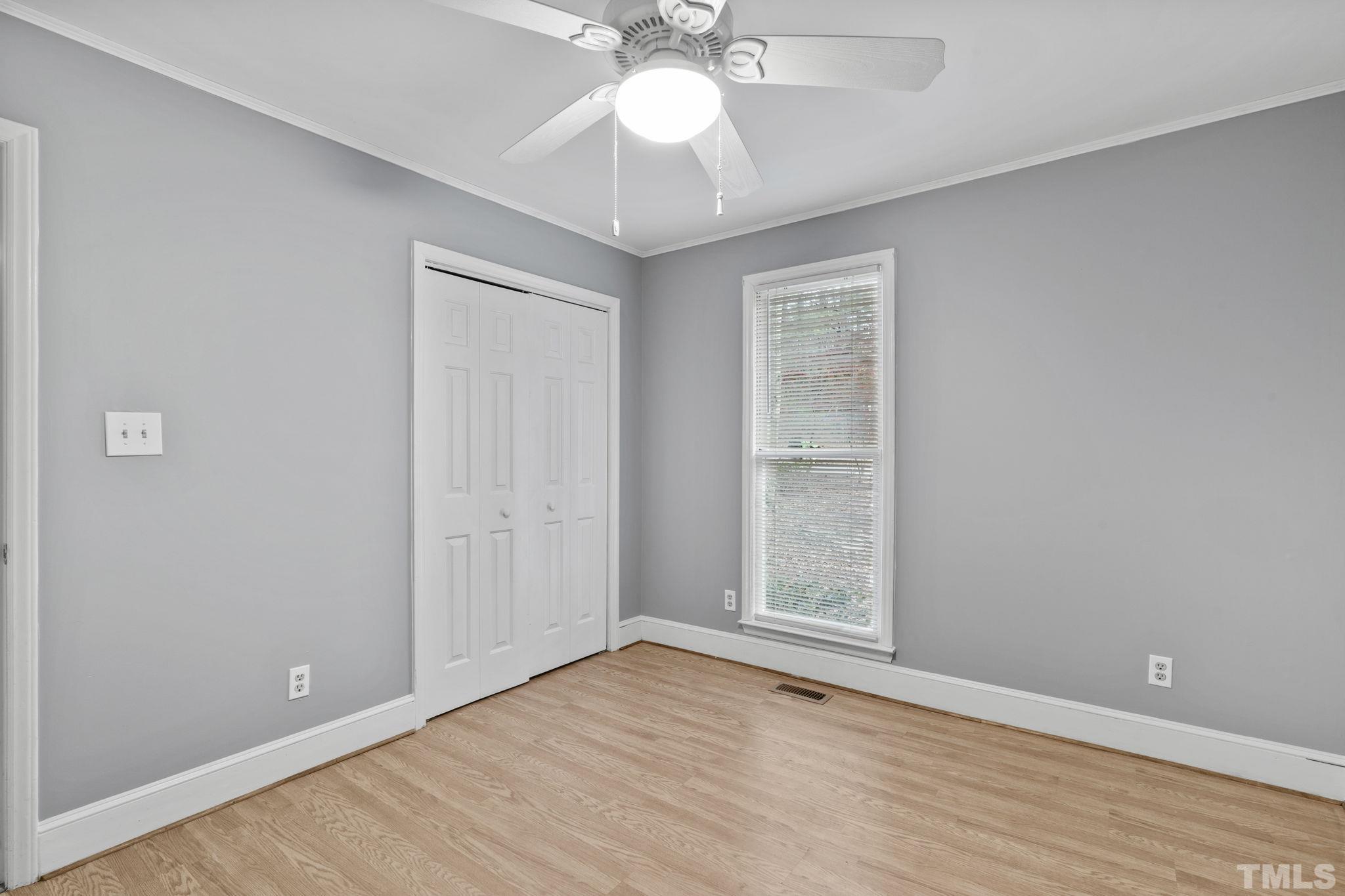 805 Van Thomas Drive Raleigh, NC 27615 - Photo 20 of 38 wooden floor in an empty room with a window