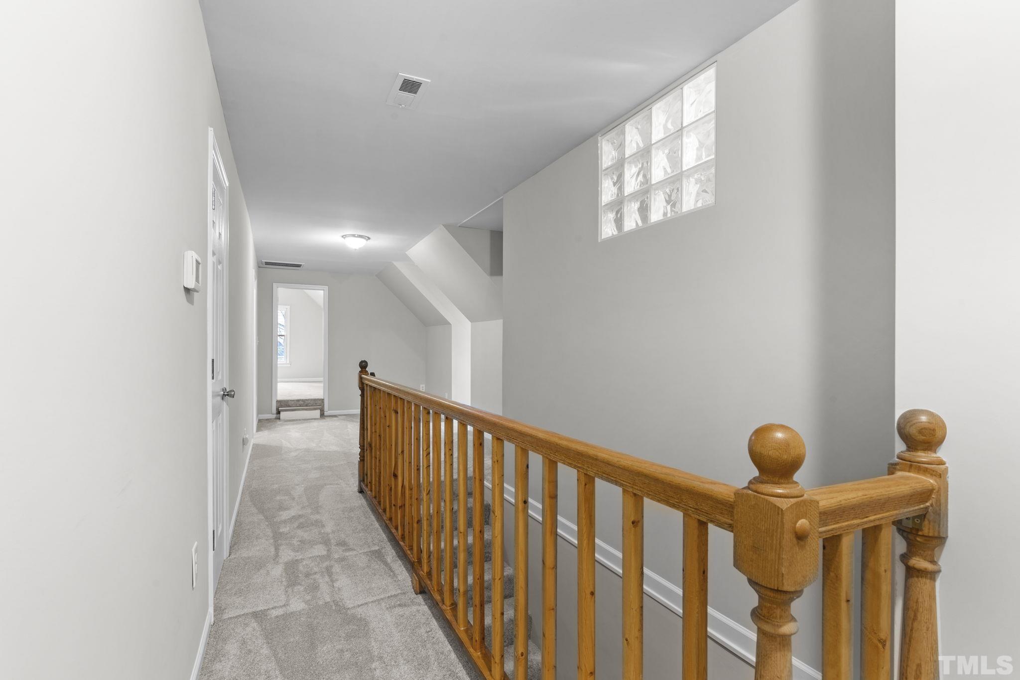 805 Van Thomas Drive Raleigh, NC 27615 - Photo 23 of 38 a view of a hallway with windows