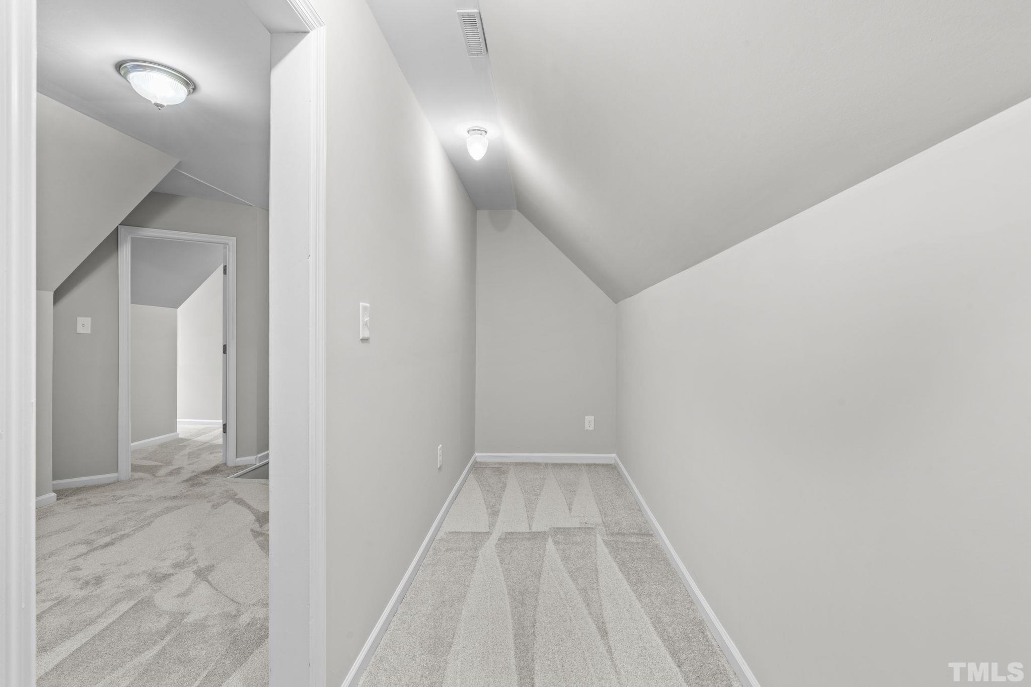 805 Van Thomas Drive Raleigh, NC 27615 - Photo 32 of 38 a view of a hallway with wooden floor