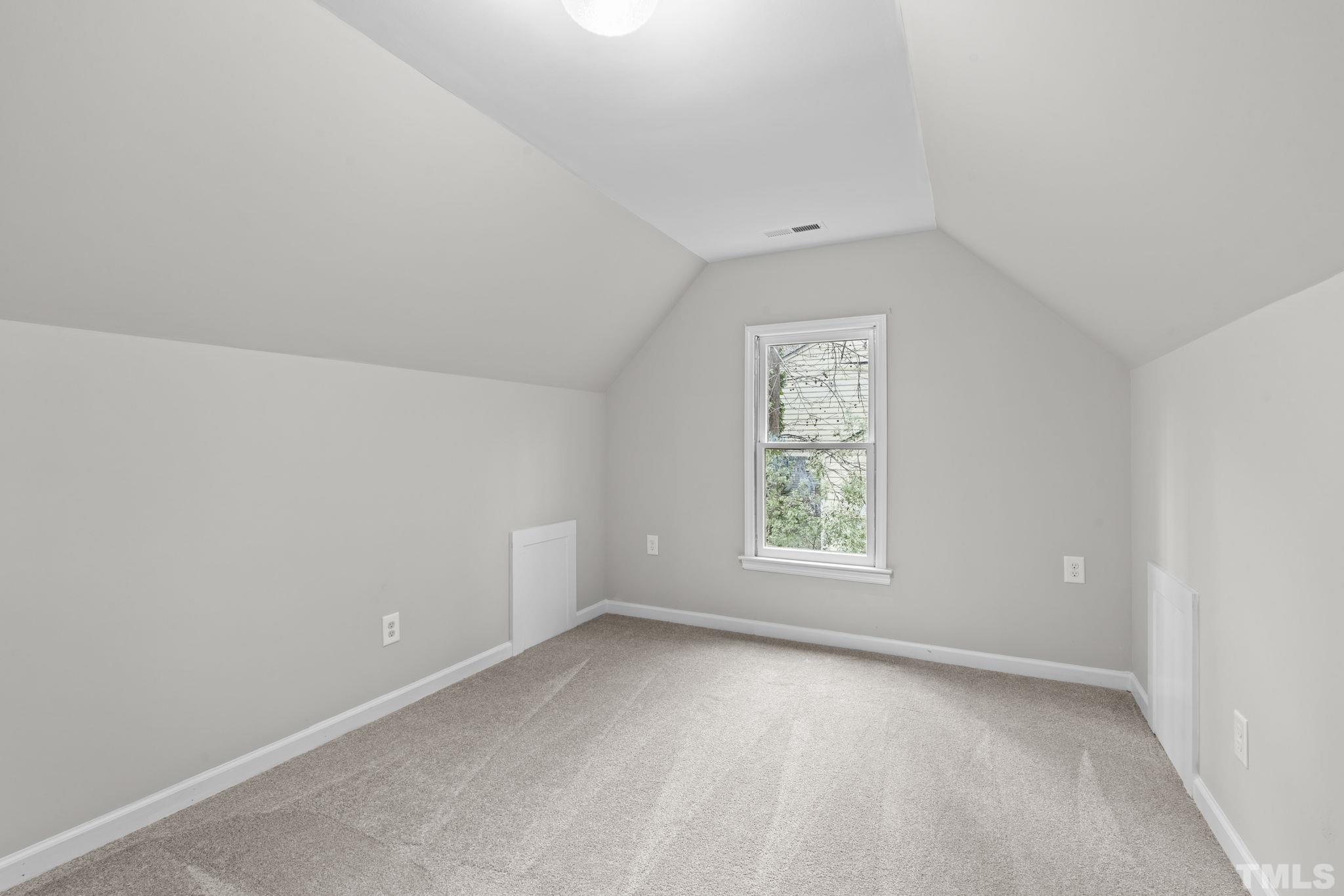 805 Van Thomas Drive Raleigh, NC 27615 - Photo 34 of 38 an empty room with a window