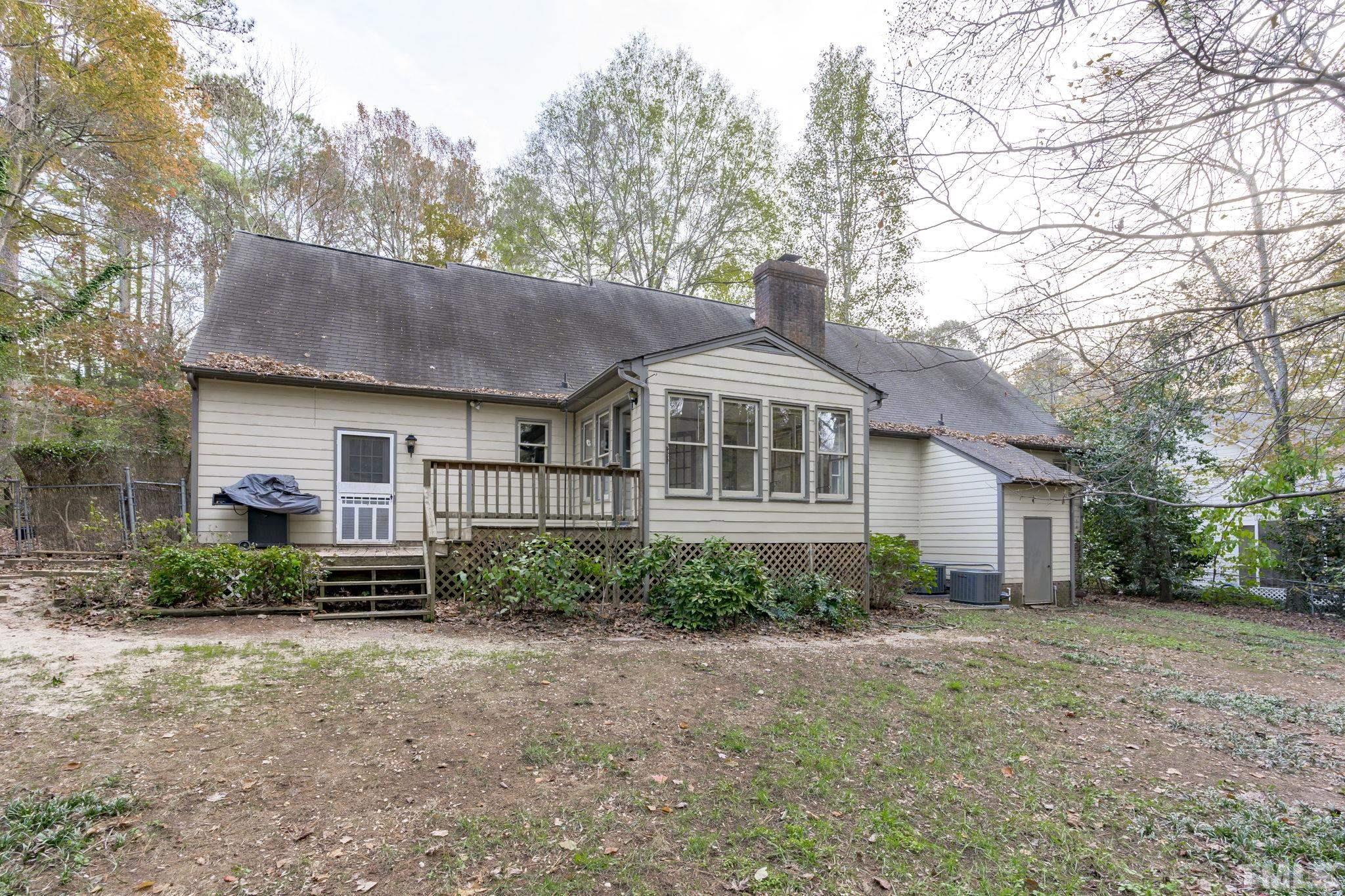 805 Van Thomas Drive Raleigh, NC 27615 - Photo 37 of 38 a view of a house with a yard and large trees
