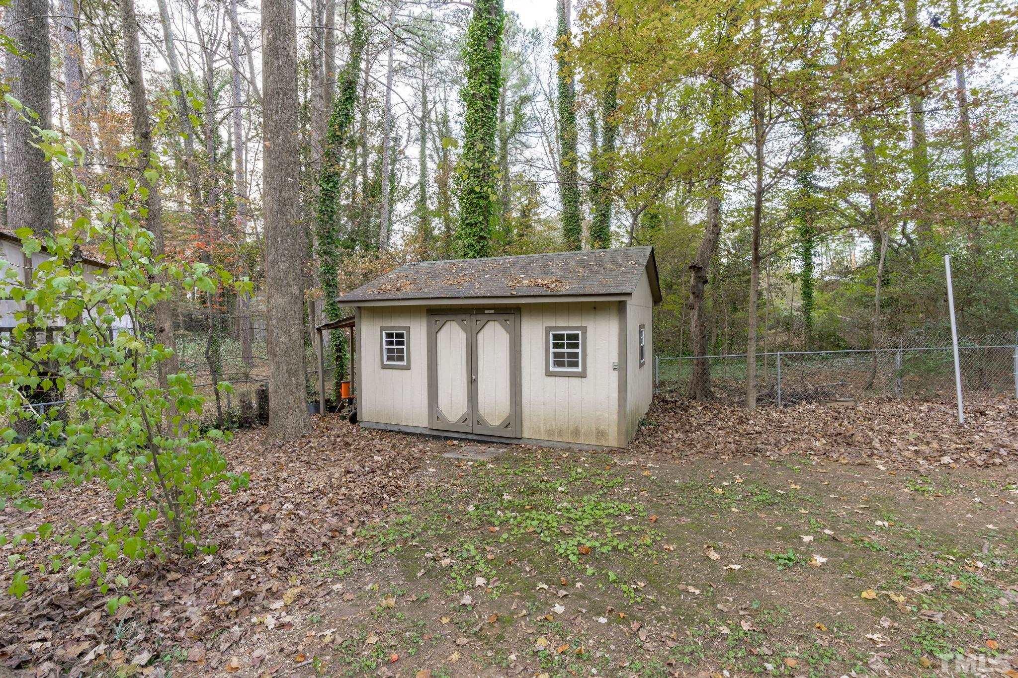 805 Van Thomas Drive Raleigh, NC 27615 - Photo 38 of 38 a view of a house with a small yard and large tree