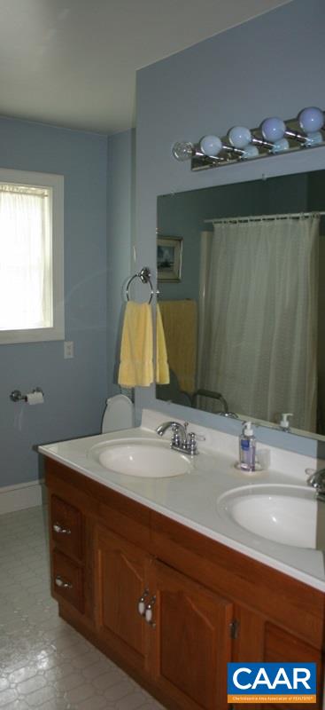 429 Beautiful Run Road Rochelle, VA 22738 - Photo 11 of 30 a bathroom with a sink and a mirror