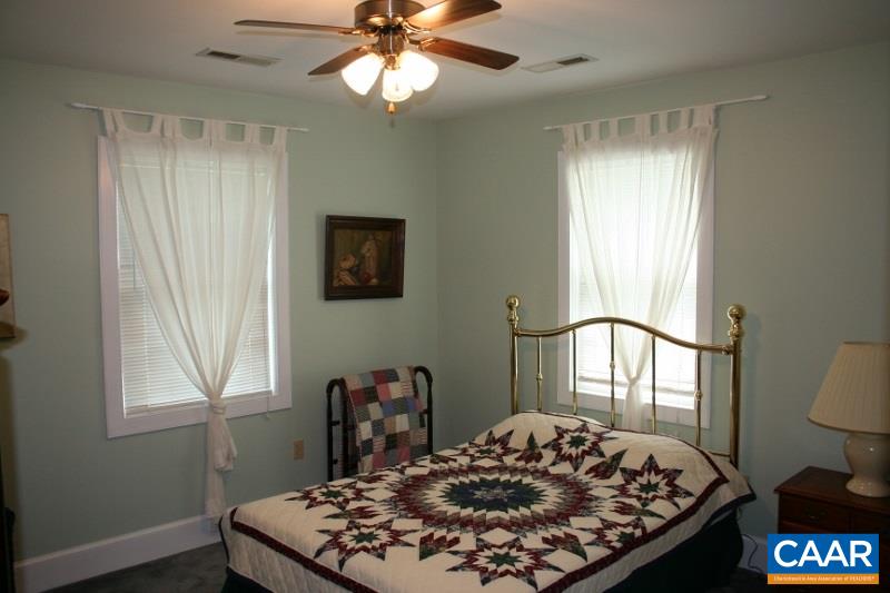 429 Beautiful Run Road Rochelle, VA 22738 - Photo 18 of 30 a bed sitting in a bedroom next to a window