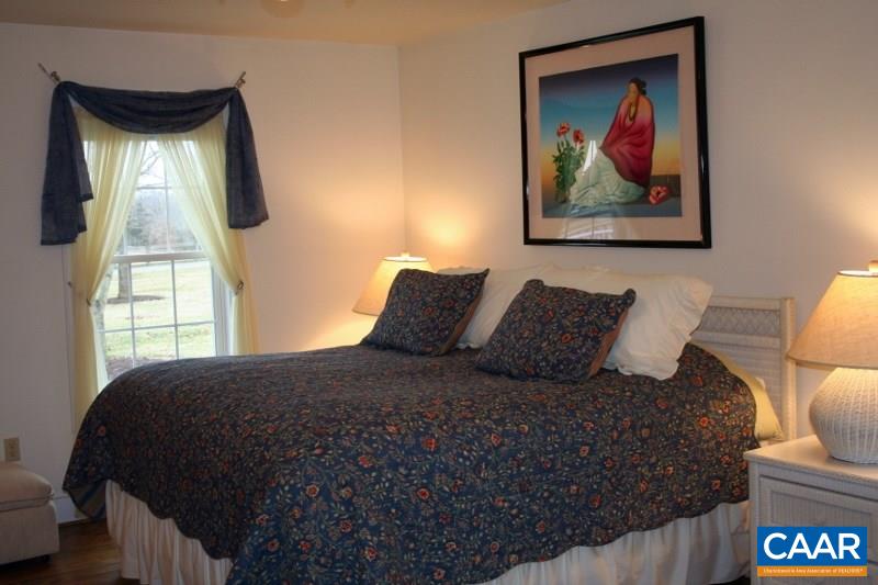 429 Beautiful Run Road Rochelle, VA 22738 - Photo 10 of 30 a large bed sitting in a bedroom next to a window