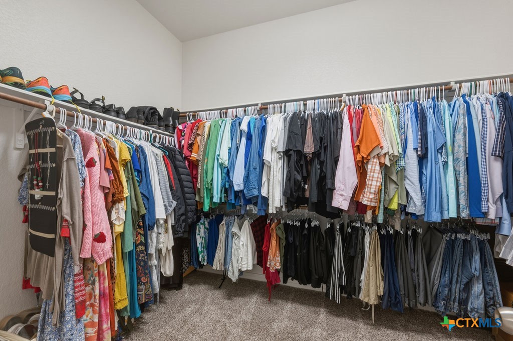 3306 Spring Canyon Road Belton, TX 76513 - Photo 27 of 40 a view of walk in closet with clothes