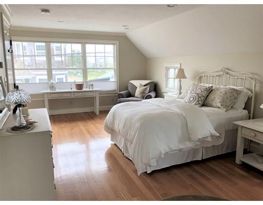 54 Lighthouse Road Scituate, MA 02066 - Photo 14 of 30 a spacious bedroom with a bed and a large window