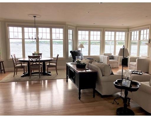 54 Lighthouse Road Scituate, MA 02066 - Photo 4 of 30 a living room with furniture and floor to ceiling windows
