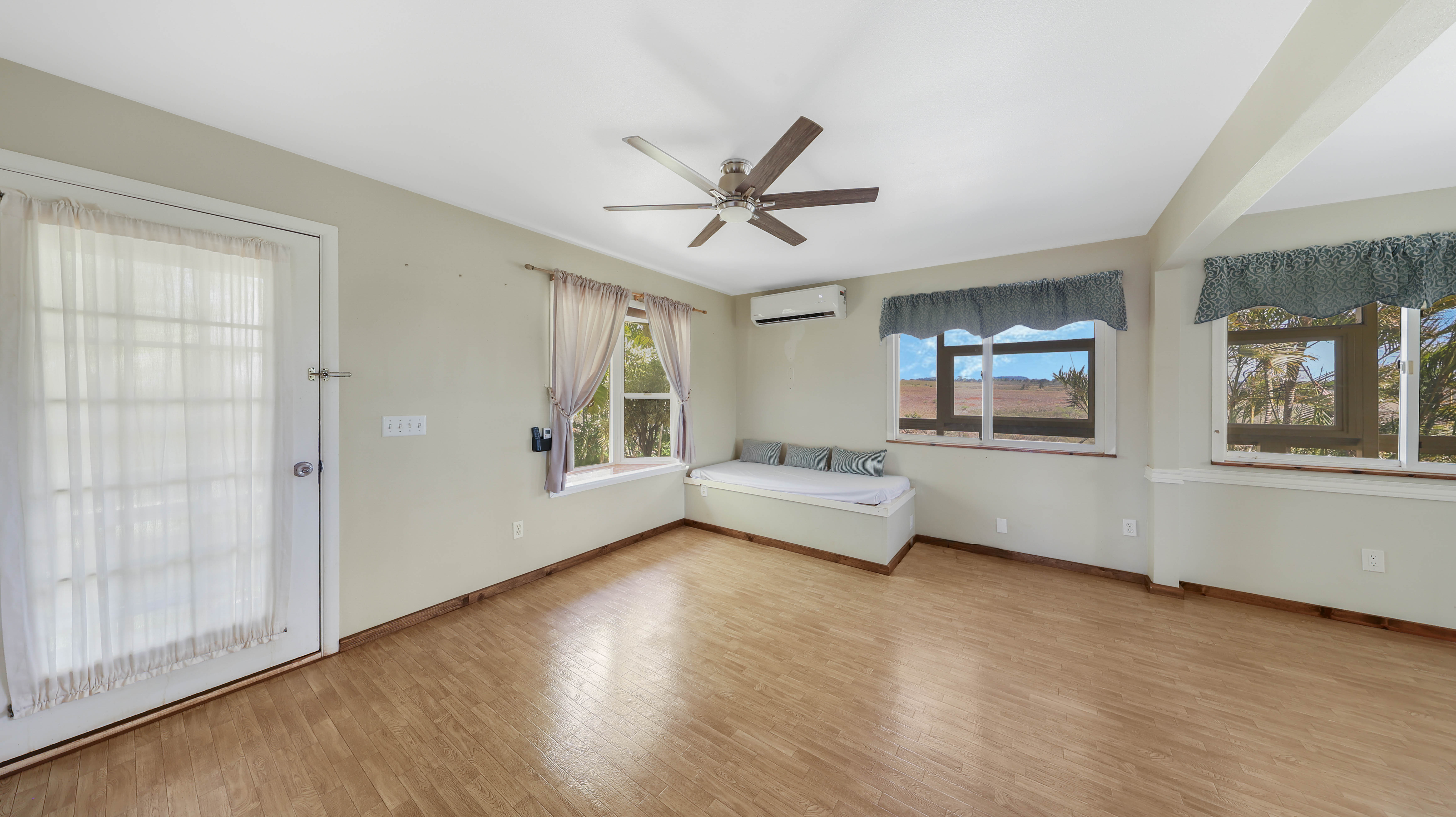 5060 Alii Road Hanapepe, HI 96716 - Photo 13 of 30 a living room with furniture wooden floor and a window