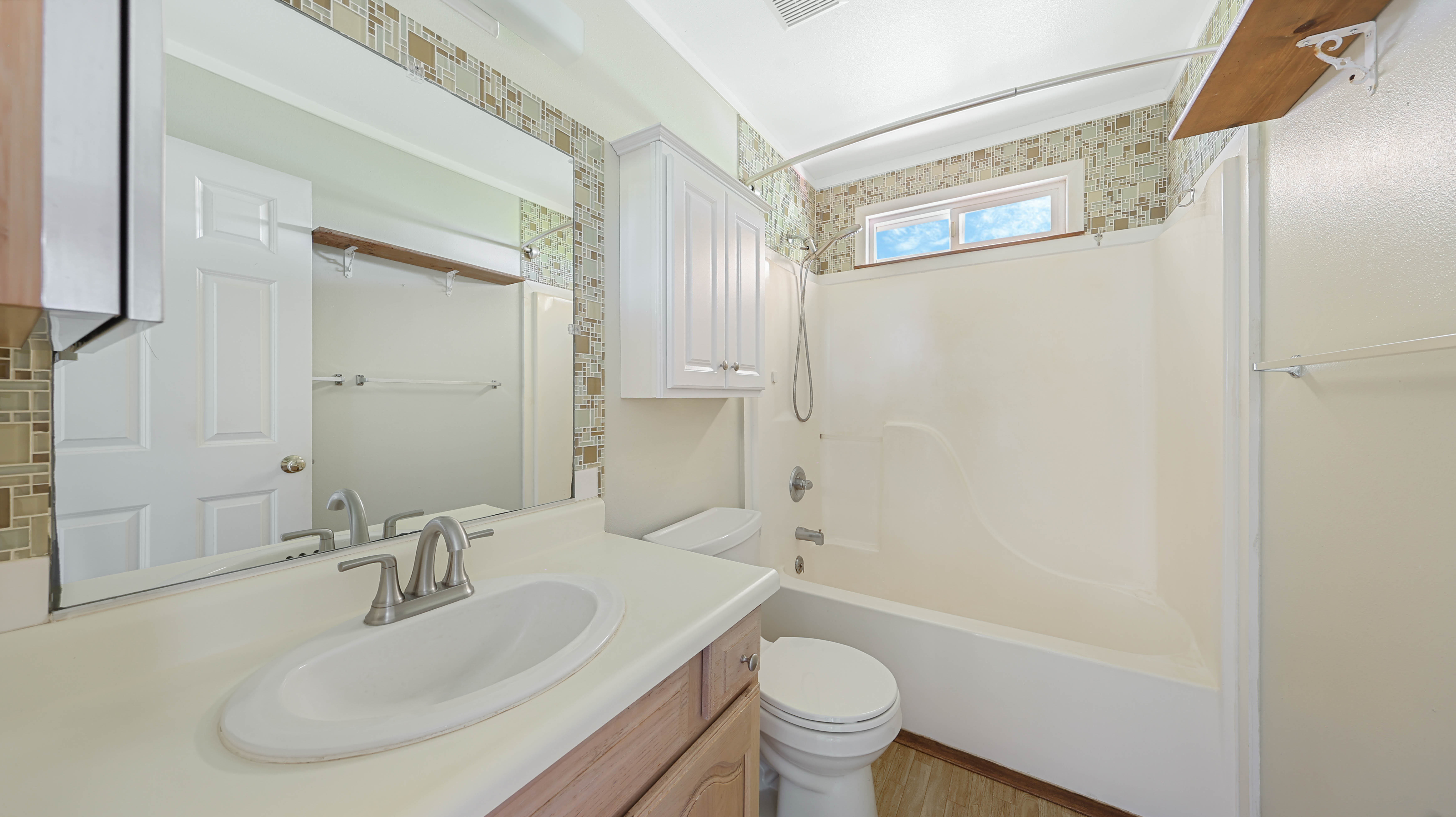 5060 Alii Road Hanapepe, HI 96716 - Photo 19 of 30 a bathroom with a sink and a mirror