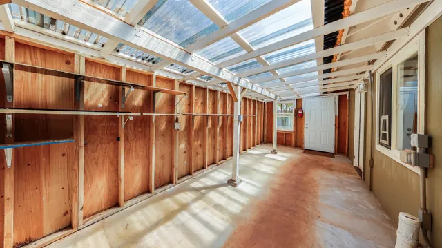 a bedroom with a bed and a shower