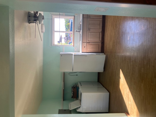 5060 Alii Road Hanapepe, HI 96716 - Photo 26 of 30 a utility room with a sink washer and dryer