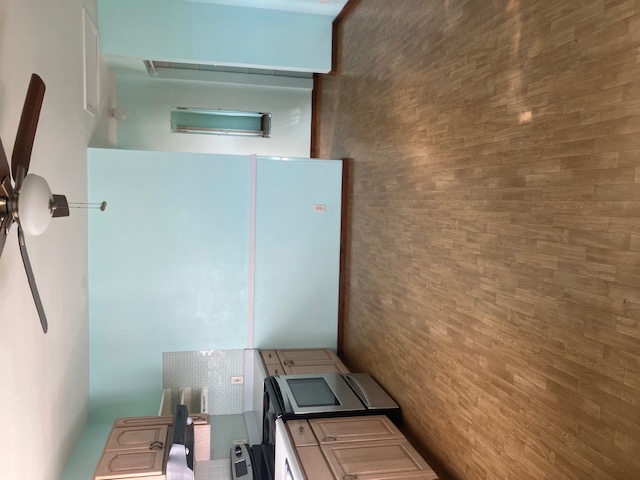 5060 Alii Road Hanapepe, HI 96716 - Photo 29 of 30 a view of a kitchen with a sink and dishwasher a stove top oven