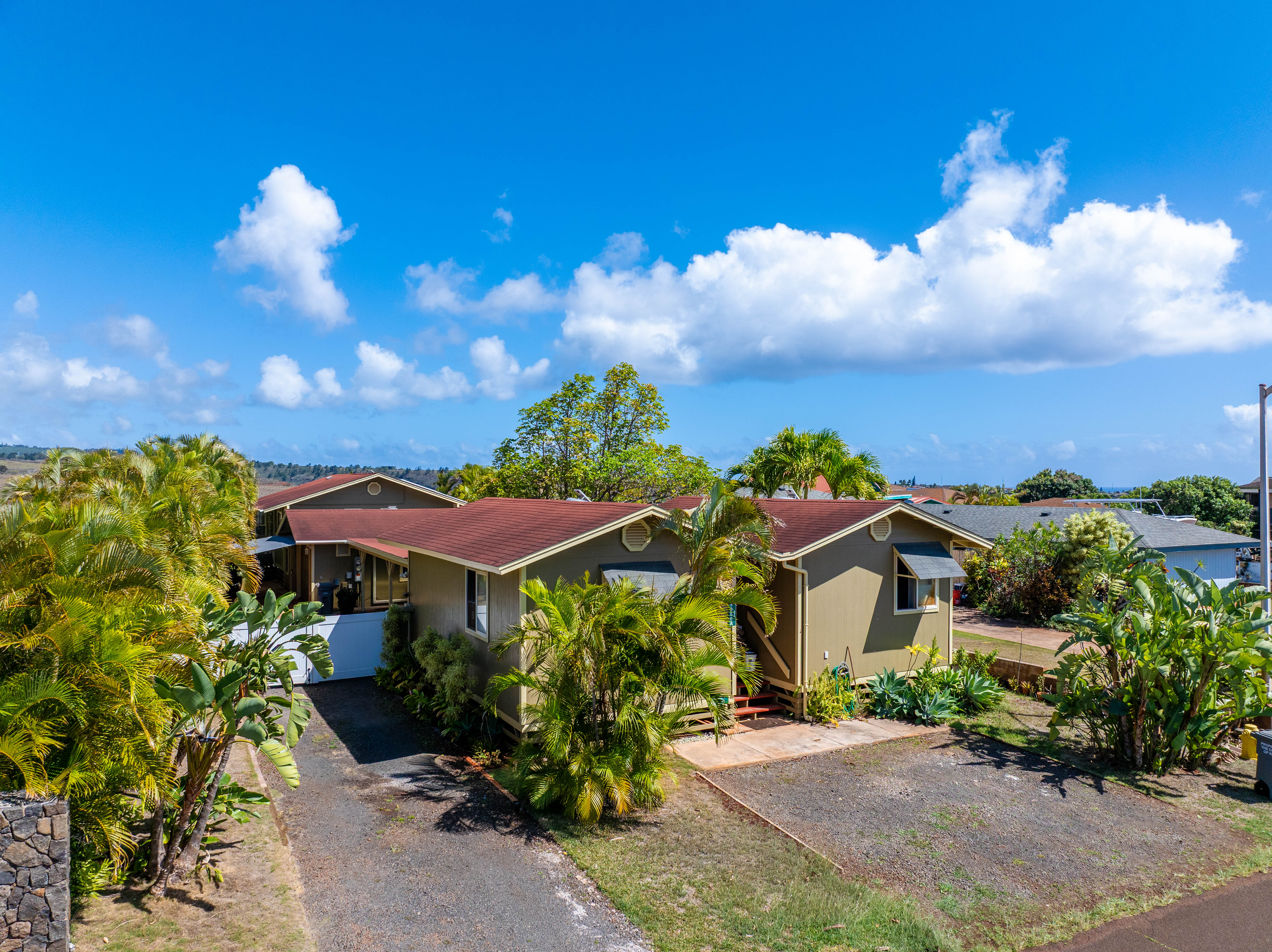 5060 Alii Road Hanapepe, HI 96716 - Photo 5 of 30 a view of a house with a yard and garden