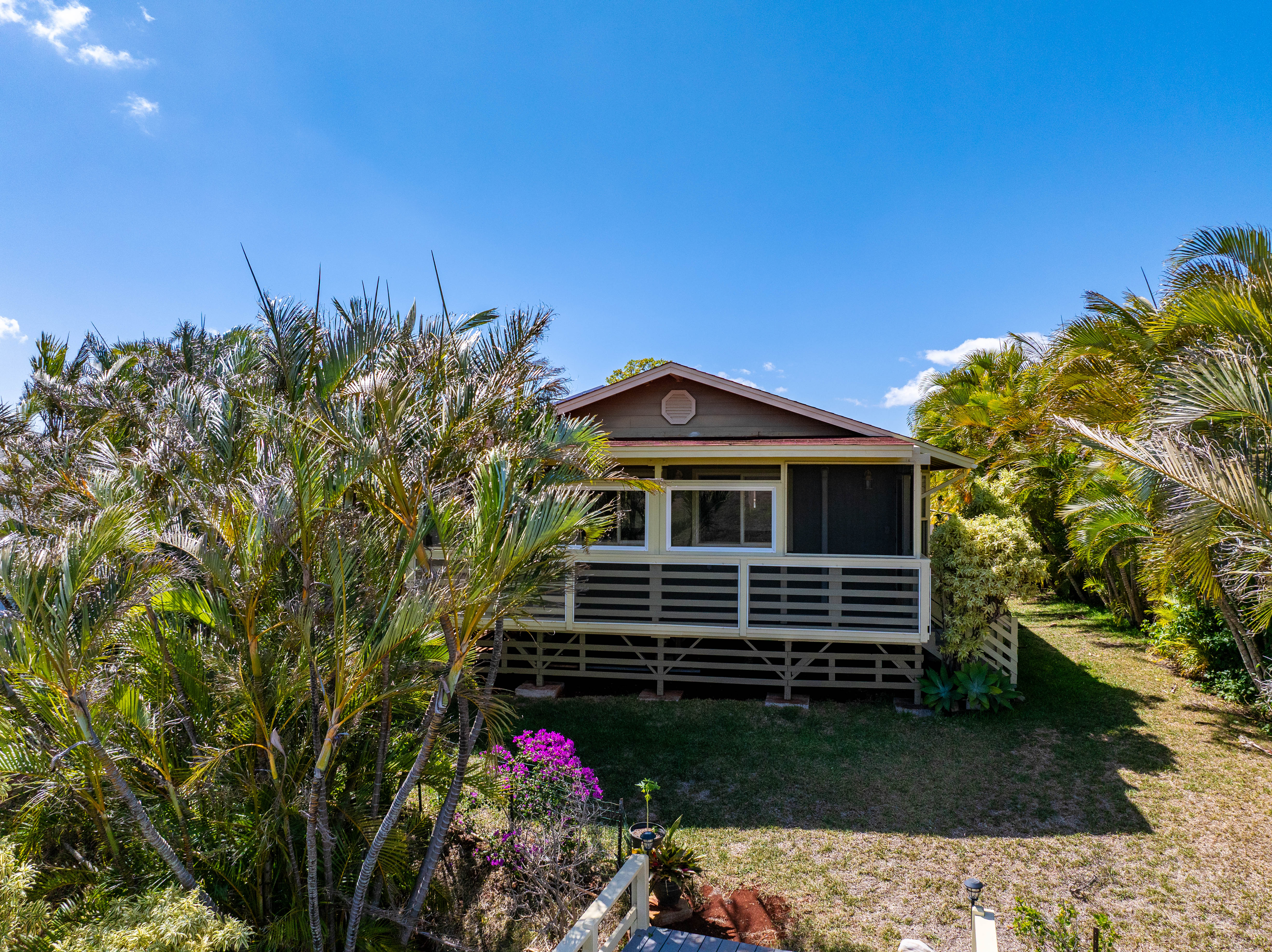 5060 Alii Road Hanapepe, HI 96716 - Photo 7 of 30 a front view of a house with a yard