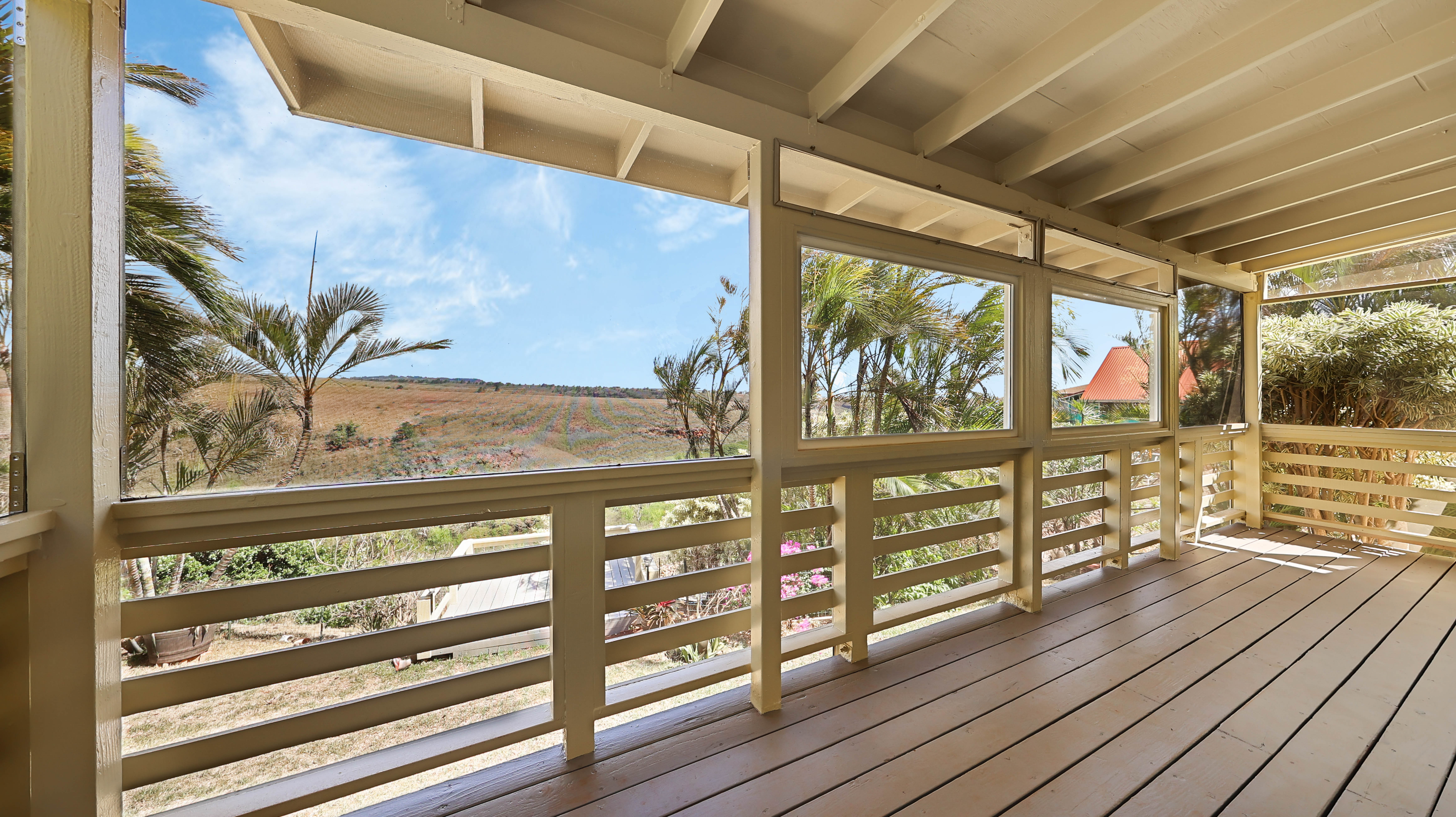 5060 Alii Road Hanapepe, HI 96716 - Photo 9 of 30 a view of a balcony with wooden floor