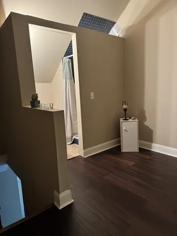 a view of a storage & utility room with wooden floor