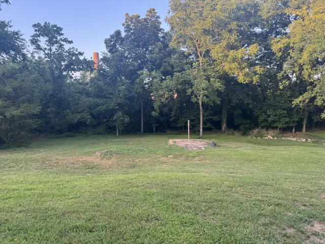a view of a yard with an outdoor space