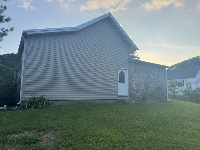 a view of a backyard of the house