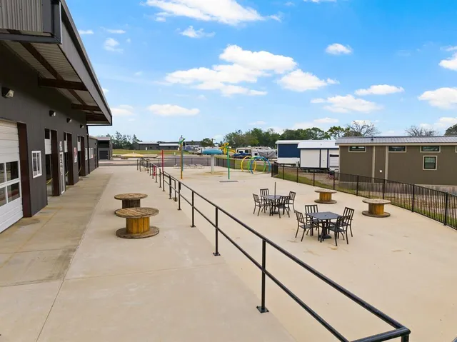 a view of a swimming pool with outdoor seating