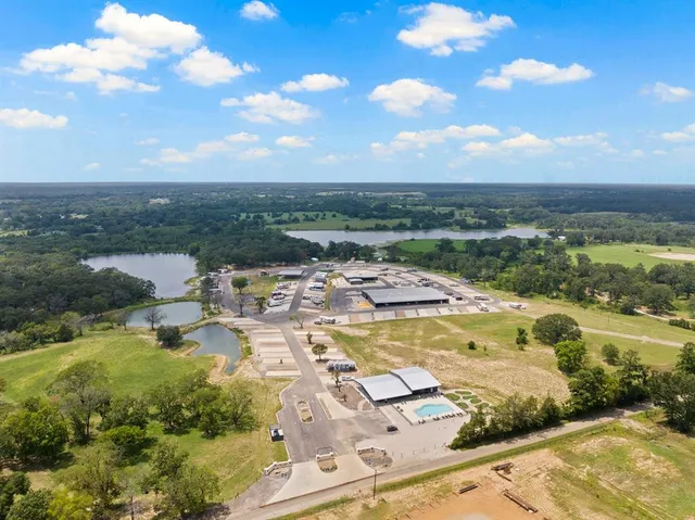 swimming pool view with a lake view
