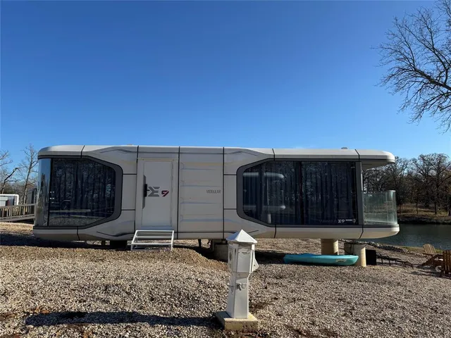 a view of a car park in front of house