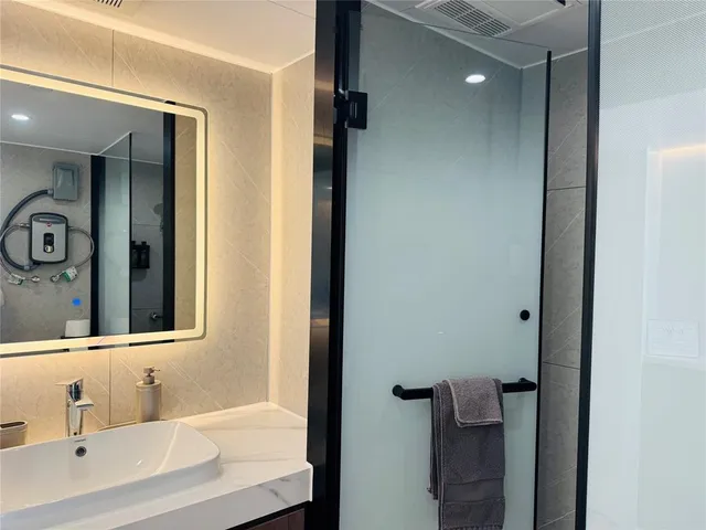 a bathroom with a bathtub and a sink