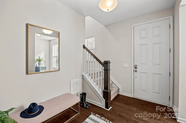 a view of an entryway with wooden floor