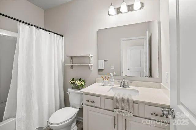 a view of a balcony with wooden floor and fence