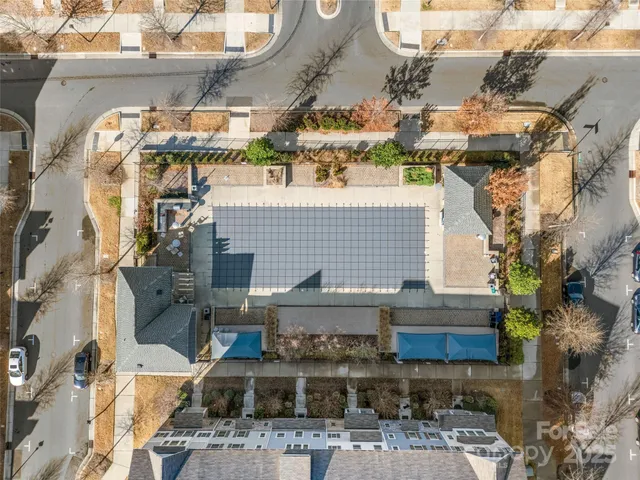 an aerial view of residential building with parking space