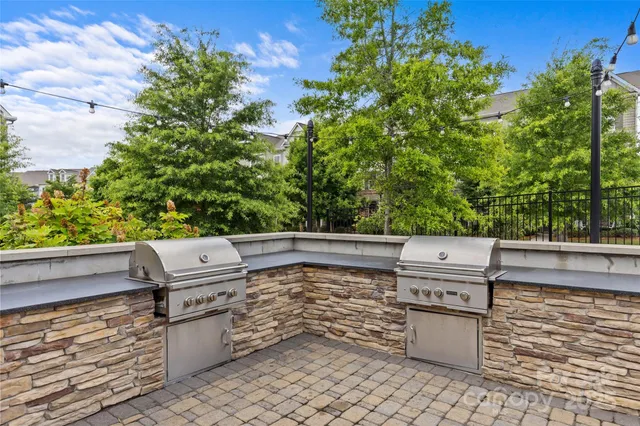 a view of residential house with outdoor space and lake view