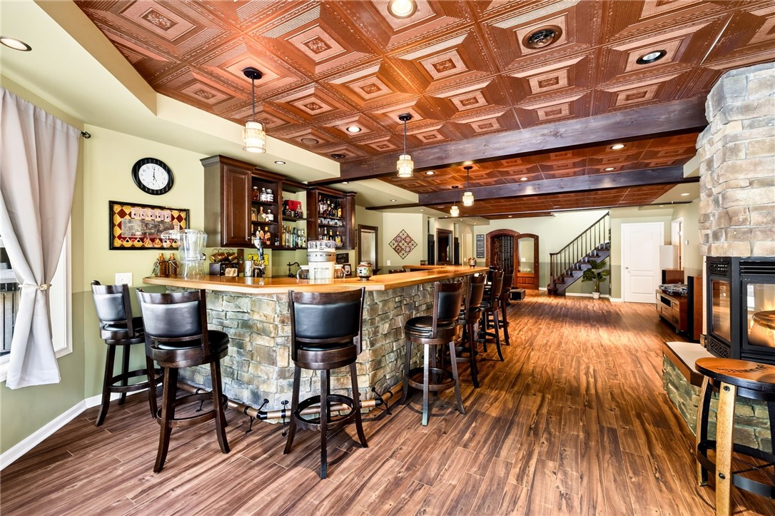 5545 Triphammer Road Avon, NY 14414 - Photo 27 of 50 Wet bar features an under-counter beverage cooler